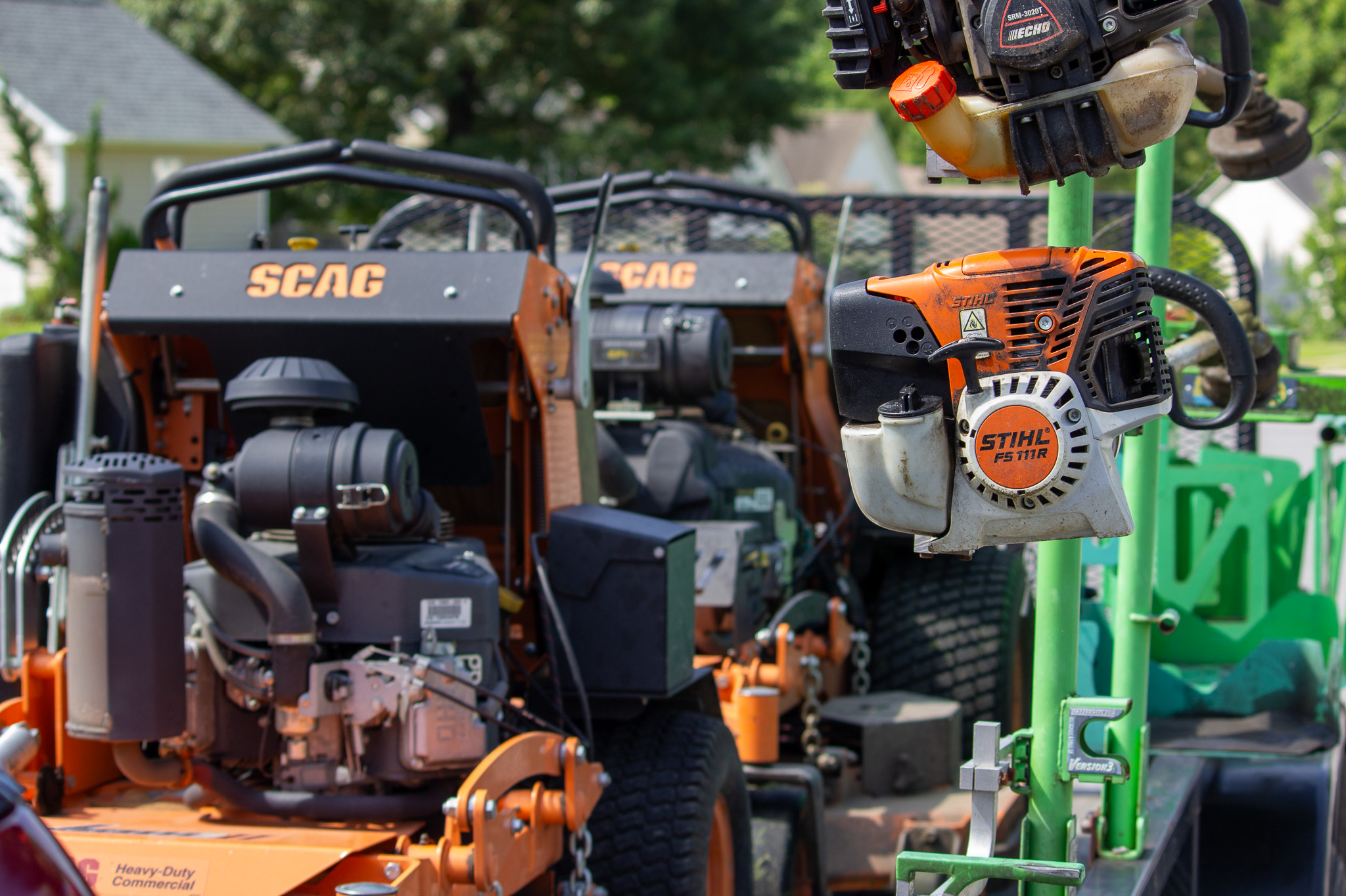 riding lawn mowers and weed eaters and other lawn care equipment on the truck.