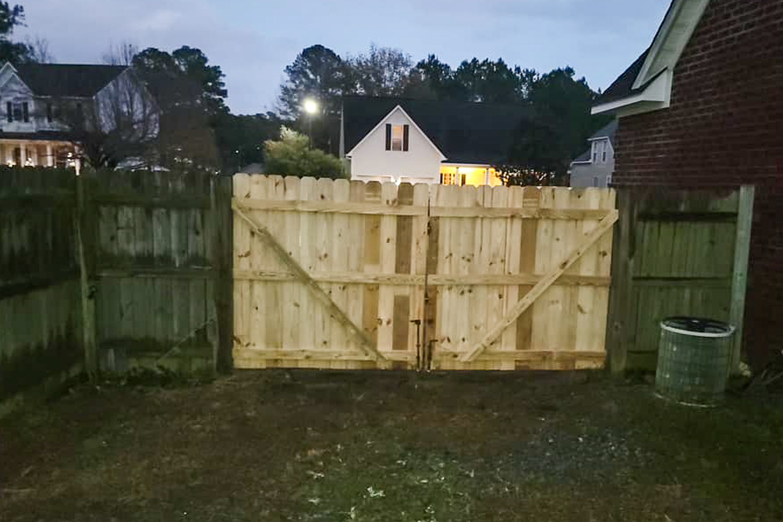 A repaired privacy fence gate.