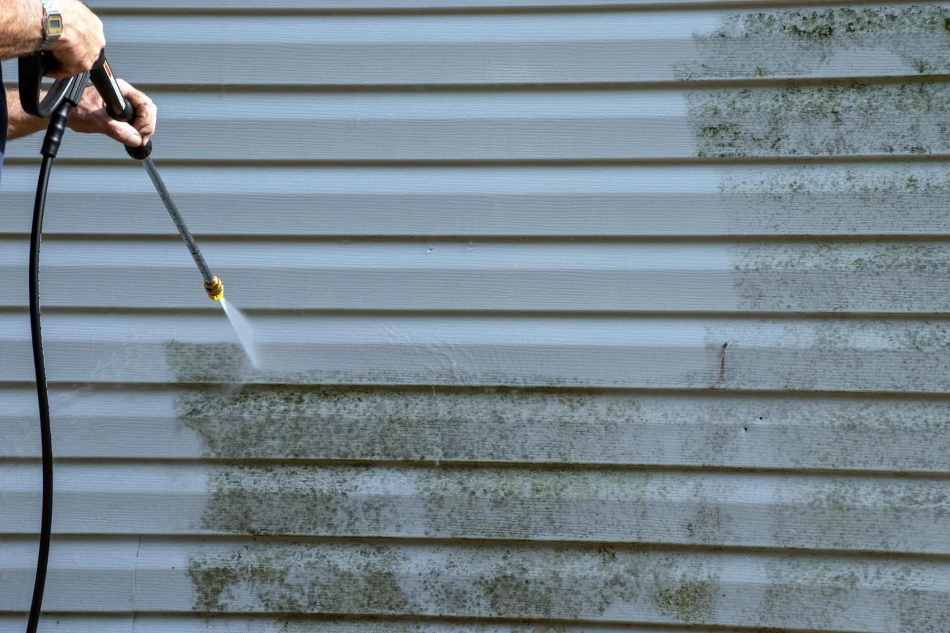 pressure washing dirt and grime from a house in onslow county.